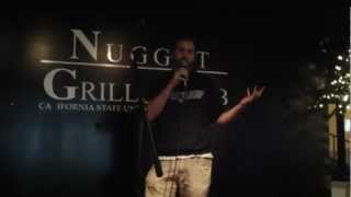 Brent Goodman performing stand up comedy at the Nugget bar on campus CSULB