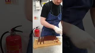 portioning our Opera Cake #baker #baking #pastrychef #chef #cotswold #patisserie #operacake #cake