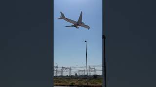 Emirates 777 in the new livery landing in Dubai