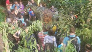 Dinosaur walks free at the Eden Project Cornwall - visitors are amazed