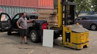 heavy forklift load on Ford Silverado pickup truck