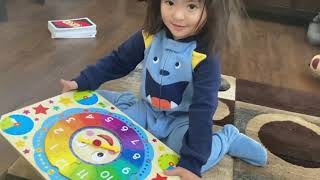 3-year-old solving clock and world map jigsaw puzzles