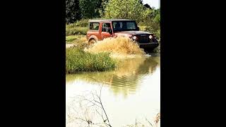 Thar doing amazing off roading in  mud and water