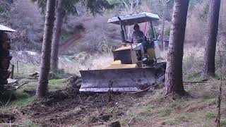 Komatsu D21A used to make a carpark at the back of a Log Cabin