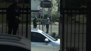 Two men playing basketball together