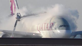 De-icing the A380 Qatar Airways in winter in Paris CDG airport