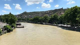 Beautiful view of Kura river from a bridge of peace in Tbilisi.