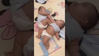 Baby twins sleep together