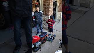 Jack and Justin changing oil on a 1979 honda Z50R minibike