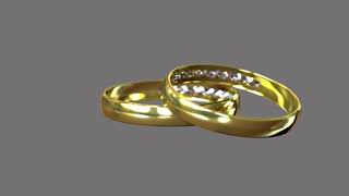 Two wedding rings on grey background Stock Video Footage