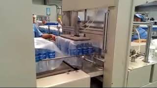 Shrink wrapping machine