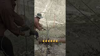 Worker cutting wire zip line