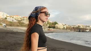 Red Head Walking on Beach