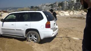 watch how Cherokee saves a GMC Envoy  stuck in Sand at Nahr El Kalb Beach