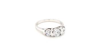 9CT. WHITE GOLD THREE STONE SEMI-TENSION/BAR SET RING