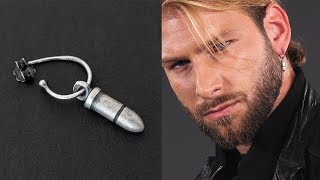 Sterling silver dangling earring for men with a bullet | Emmanuela®