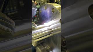 Welding electrical heating elements to the "tubesheet" of an electric circulation heater.