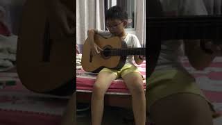 8 years old boy practises arpeggio