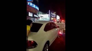 Woman tries to stop her car from being towed