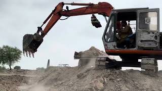 Excavator Loads Trolley