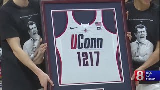 UConn fans celebrate Coach Geno Auriemma's legacy as he earns new NCAA record