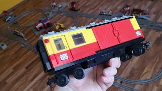 Lego vintage (80s) Postman with letters, packages and 7740 mail car.