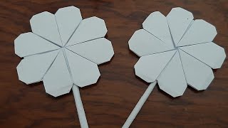 طريقة عمل وردة رائعة من الورق ( اوريجامي)..origami ) How to make a wonderful rose of paper )