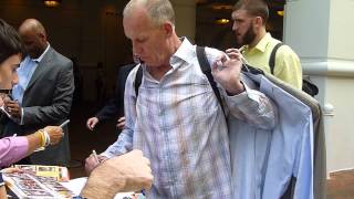 Doug Collins, Head Coach of the Philadelphia 76ers, signing several autographs - TopSignatures.com