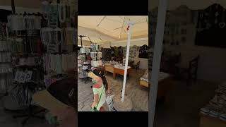 Walking around Limenas Thassos Old Port, shops, beach, taverns in daylight in June 2024