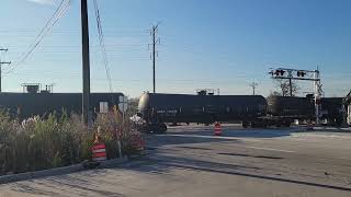 IAIS 500 and IAIS 504 mixed freight train at Houbolt Road crossing