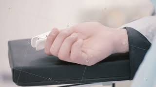 Close up of a human hand with a sensing device connected to it. Action. Sedated patient with a heart