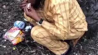 Video of a suspected yahoo boy eating fieces with bread for rituals