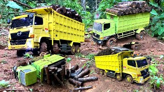 RC TRUCK HINO NEKAT TRABAS JALAN BERLUMPUR SAAT HUJAN DERAS BAWA MUATAN KAYU SAMPAI TERGULING