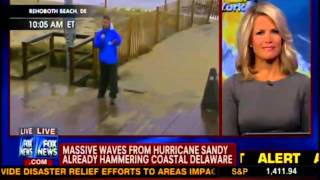 Fox News reporter falls over & hurts foot in Hurricane Sandy