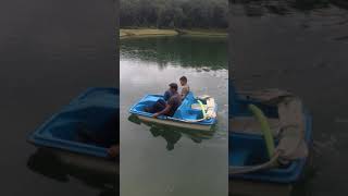 Kevin and Uncle Danny in paddle boat on the Lake 2