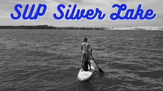 Paddle Boarding with my Standard Poodle on Silver Lake in Michigan