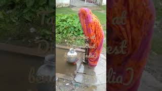 Digha village water# tap water# village water system# woman pumping water# underground water