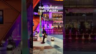 The streets of Tenjin, Fukuoka bustle with life and color at night.