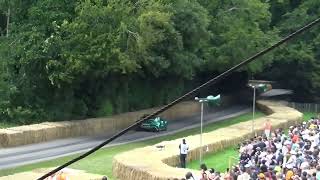 Rumbling V8 Aston Martin F1 Safety Car heading up the hill at Goodwood Festival of Speed