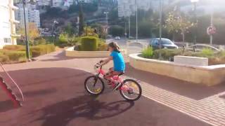 Emily riding a bicycle for the 1st time