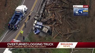 Logging truck overturns, dumps load down hillside in Westmoreland County