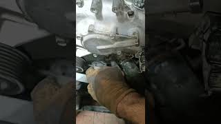 Nissan Pathfinder fan belt location