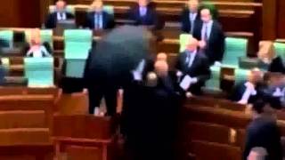 Kosovo: PM Isa Mustafa pelted with eggs in parliament - BBC News