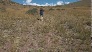 Woman walking in the Altai mountains