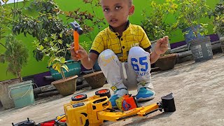 Tanvir is playing with remote control JCB and running remote control JCB.