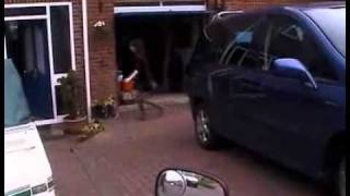 Motorcycle_rider_invents_unique_garage_opener._VIDEO1.wmv