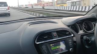 Brand new tata tigor driving on highway