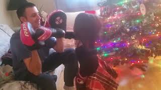 Dad and Lexi having fun.  1st day boxing with 6oz gloves hitting focus mitts.