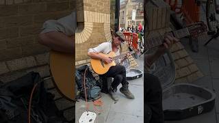 STREET MUSICIAN PERFORMING IN LONDON