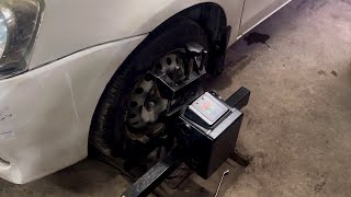 Car wheel alignment with machine